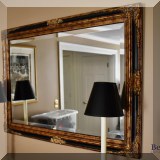 D14. Gold and black beveled glass mirror. 30”h x 42”w 